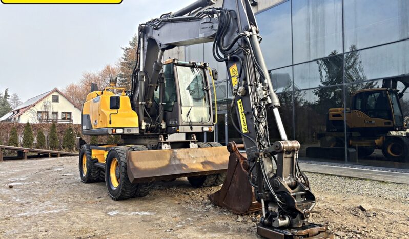 VOLVO EW 140 D KOPARKA KOŁOWA Z GŁOWICĄ OBROTOWA ZE SZCZYPCAMI full