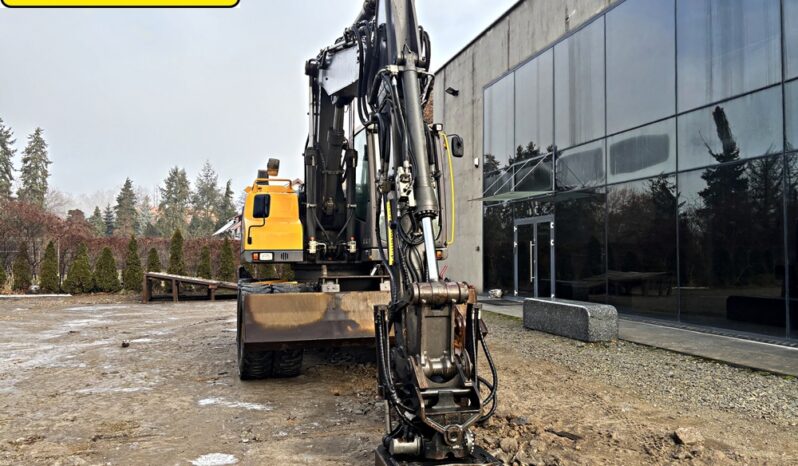 VOLVO EW 140 D KOPARKA KOŁOWA Z GŁOWICĄ OBROTOWA ZE SZCZYPCAMI full